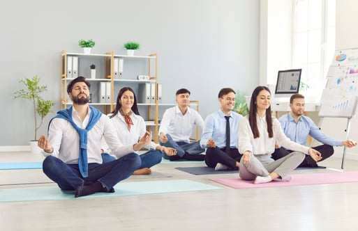 office workers doing yoga for work life balance