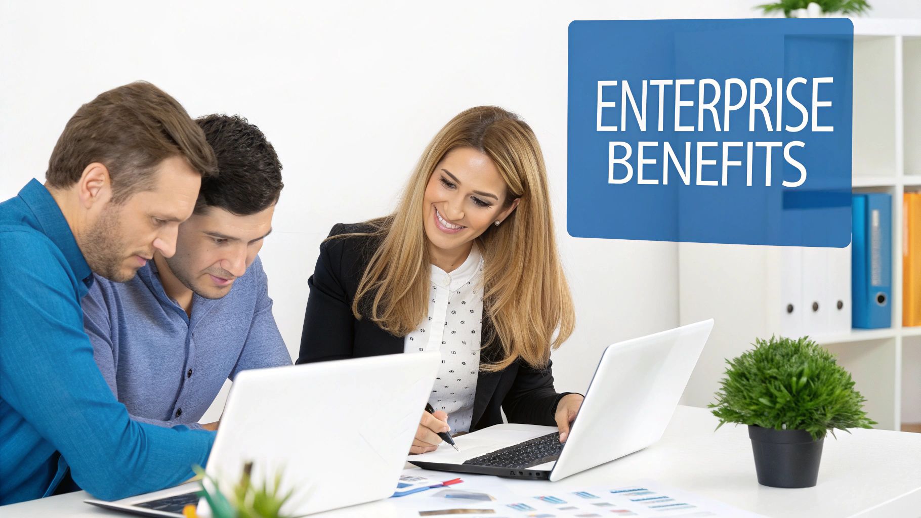 Three diverse professionals collaborate in an office, discussing 