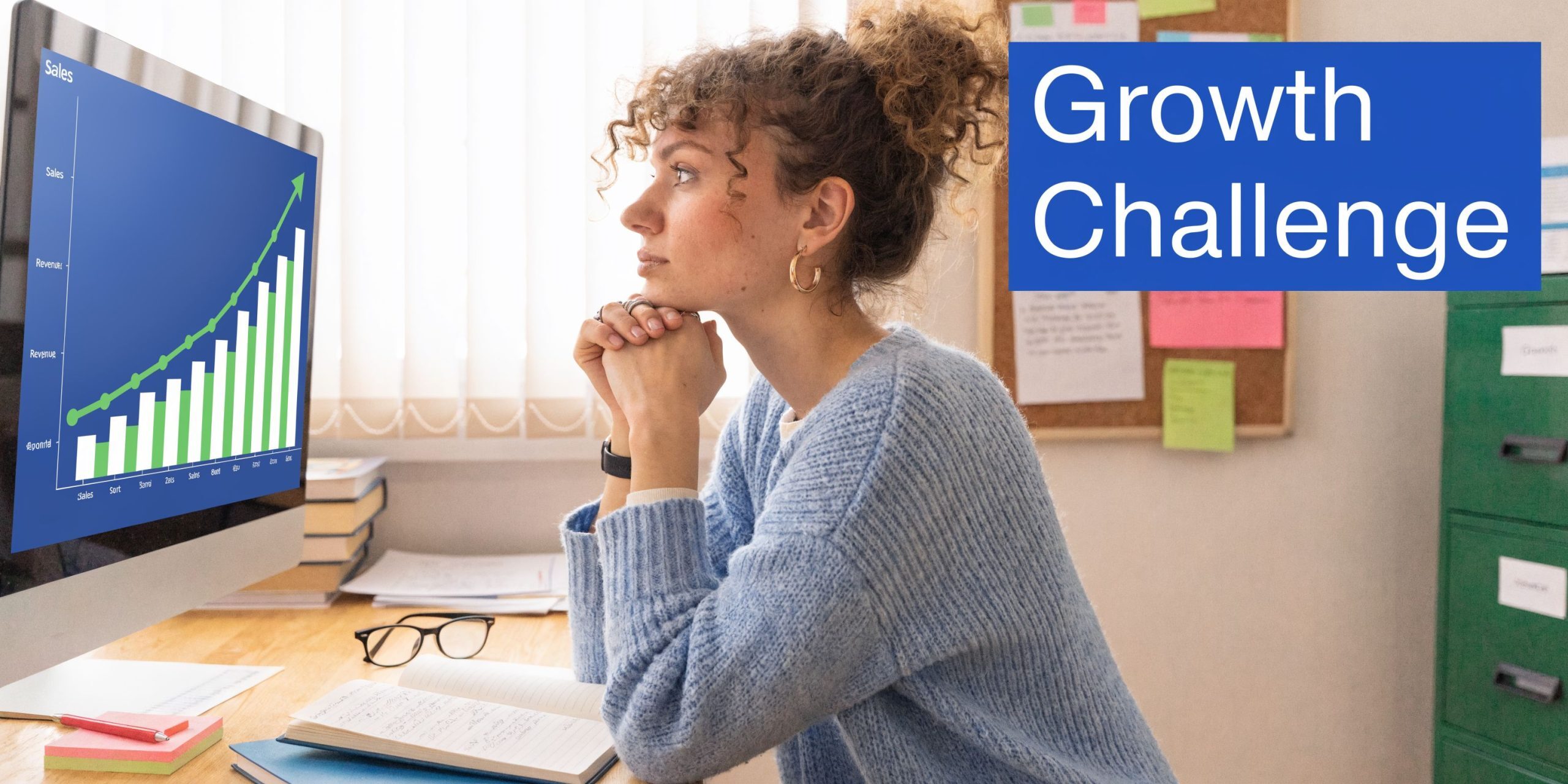 A woman with curly hair looks thoughtfully at a computer screen displaying an upward-trending sales growth chart.