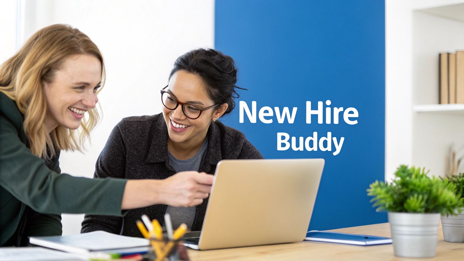 Two smiling women collaborating on a laptop, with text 'New Hire Buddy' on a blue background.