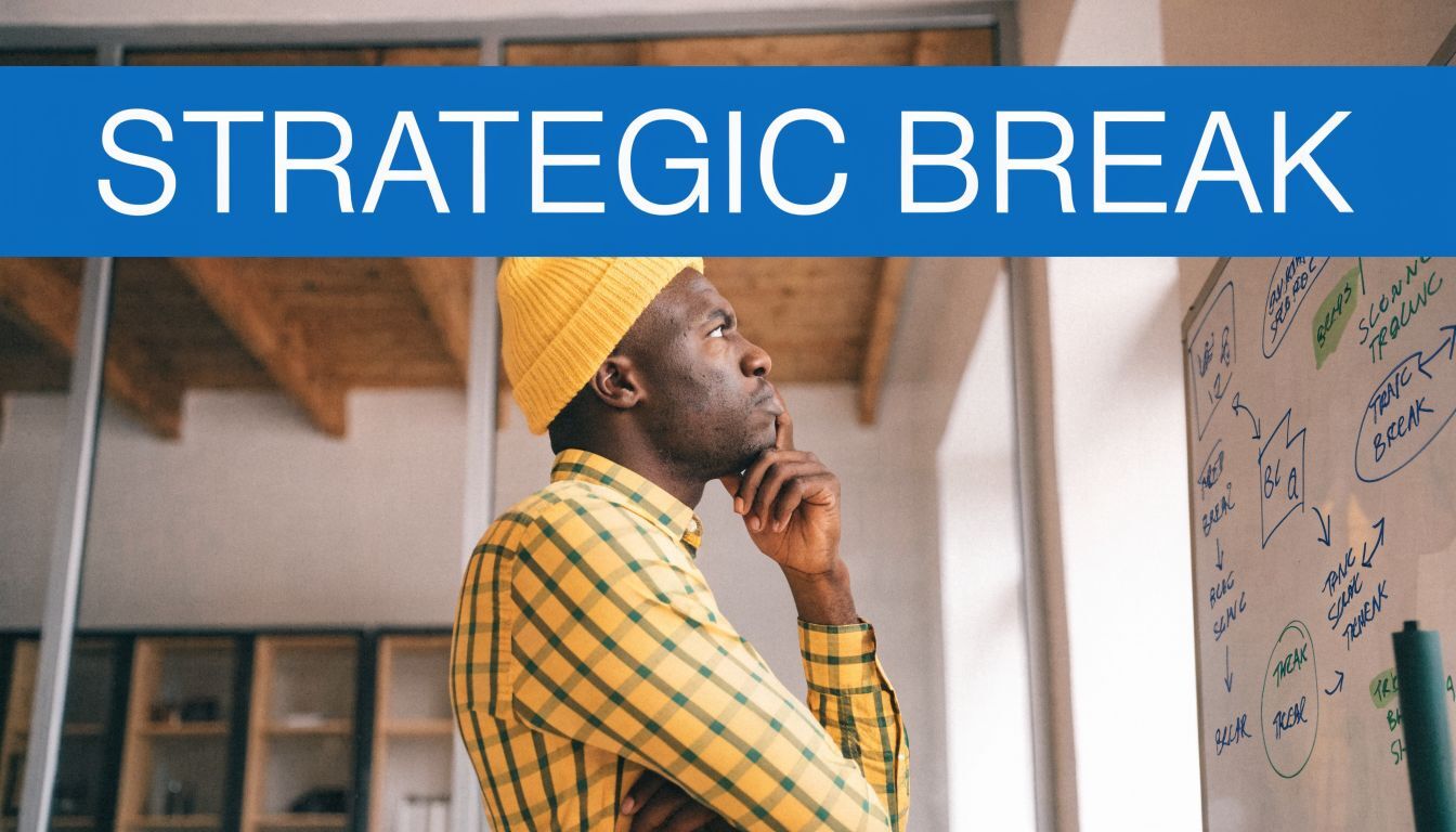 A thoughtful man wearing a yellow hat and checkered shirt looking at notes on a whiteboard.